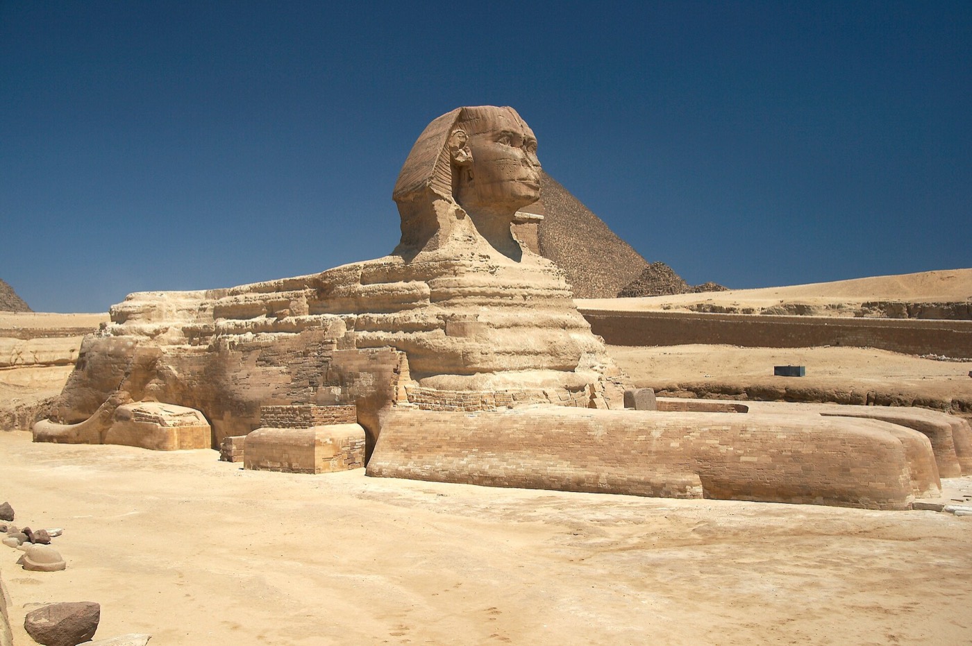 The Great Sphinx of Giza, carved from the limestone bedrock of the Giza Plateau.